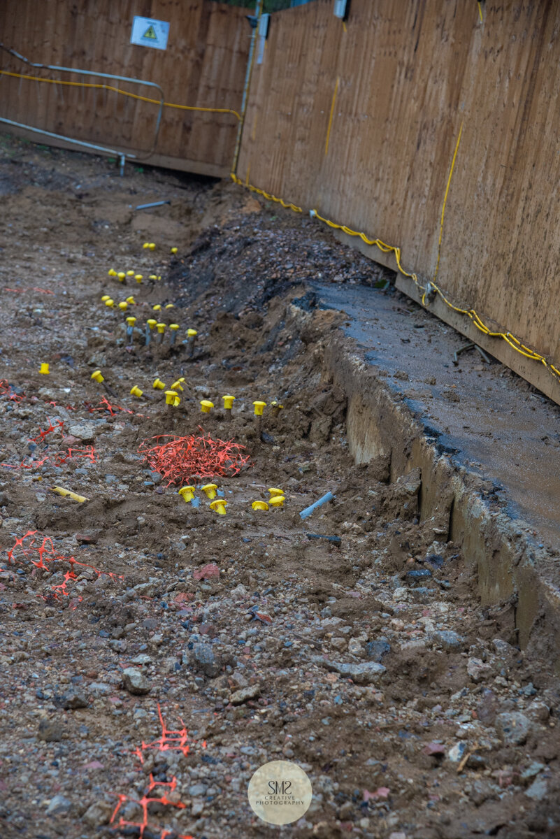  A row of piles, covered with protective caps, ready for the next stage. 