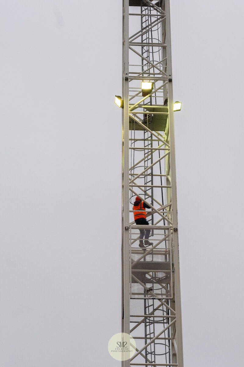  To get to the work platform this workman has to climb 30 metres. The ladders are divided into sections with a safety platform separating each one. 