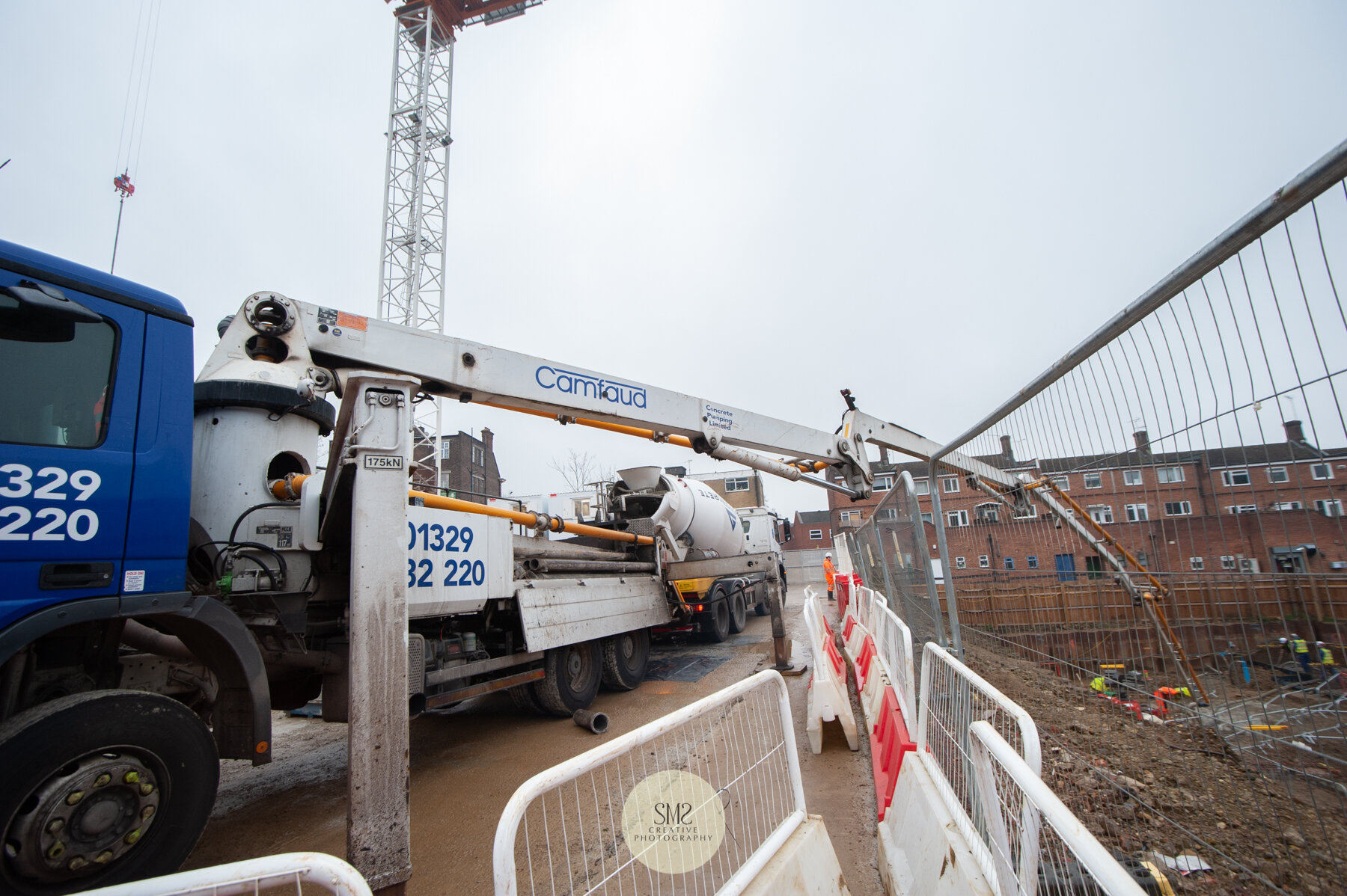  This mobile concrete pump was hired for the day to assist with depositing large quantities of concrete via a long arm into the base of Block C. 