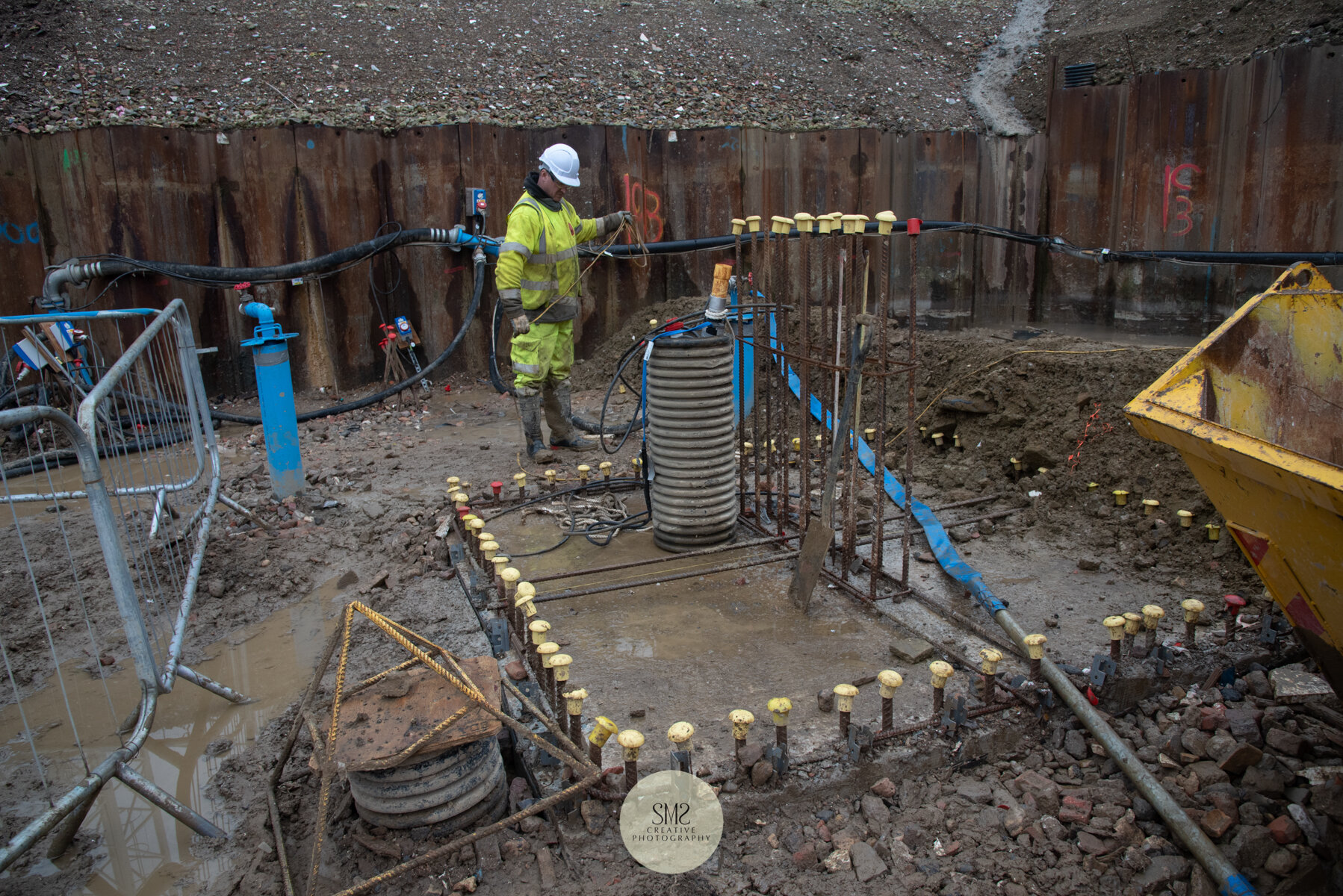  The pile cap, the bars poking out the top are column starter bars. The blue columns are dewatering wells to assist with the ground water levels. 