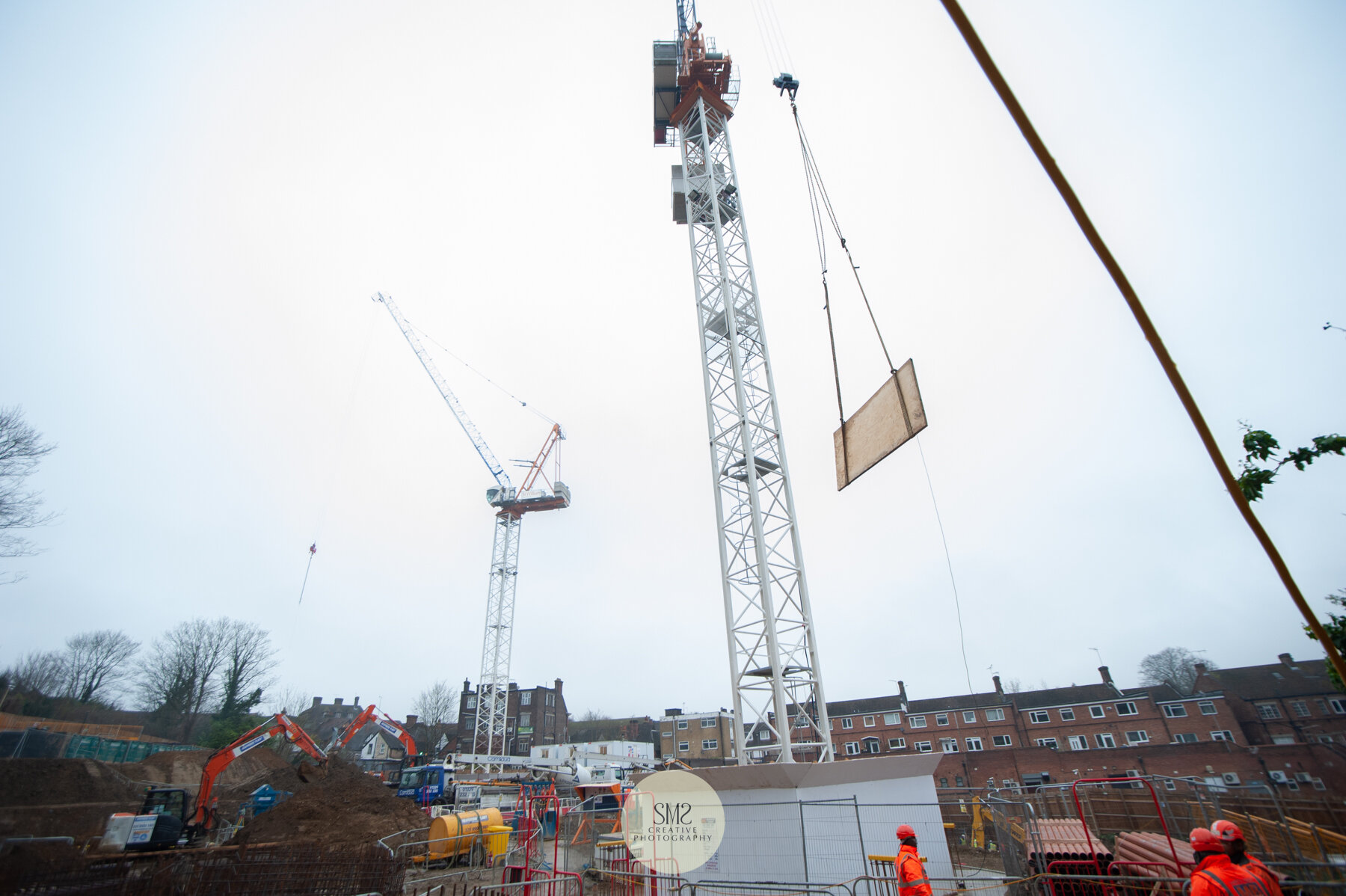  The two tower cranes work together to save time moving materials accross the site. 