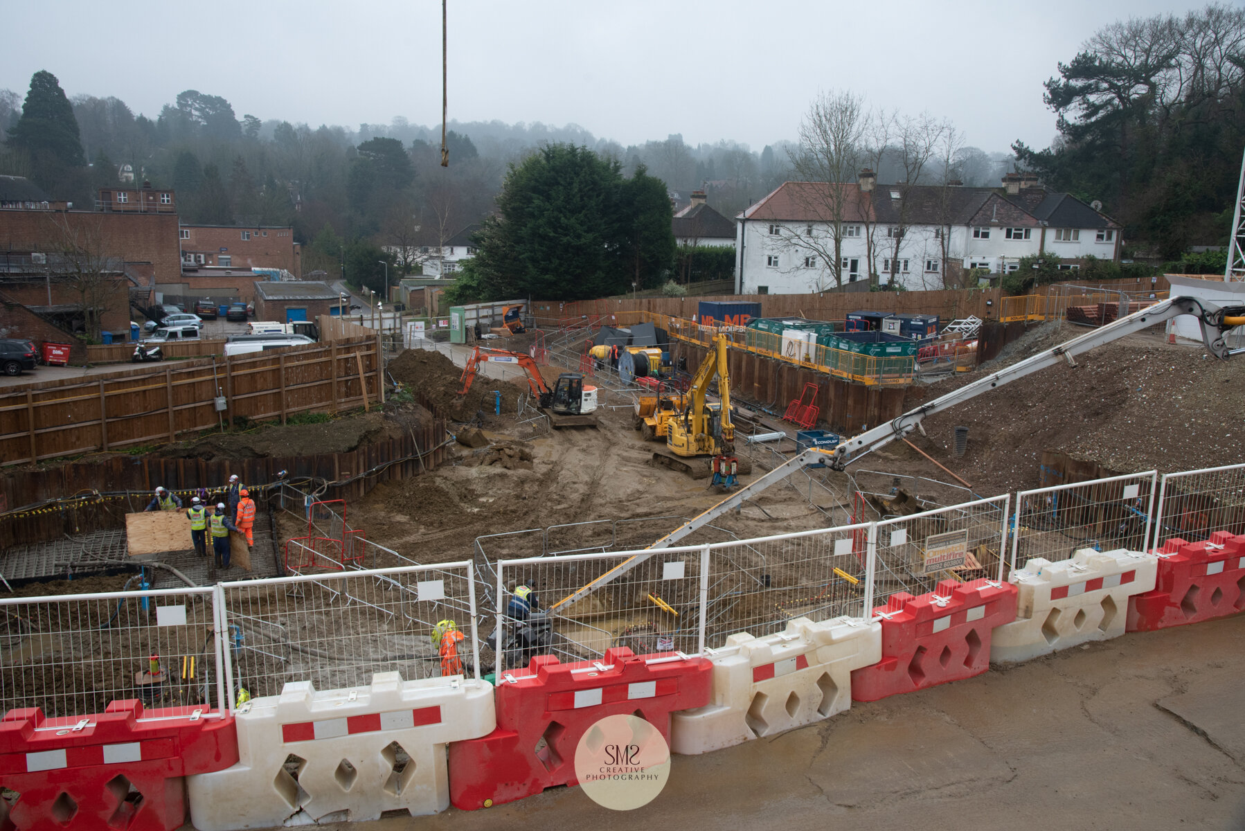  A view from the portacabins towards Block C showing the arm from the concrete pump depositing to the base concrete. 