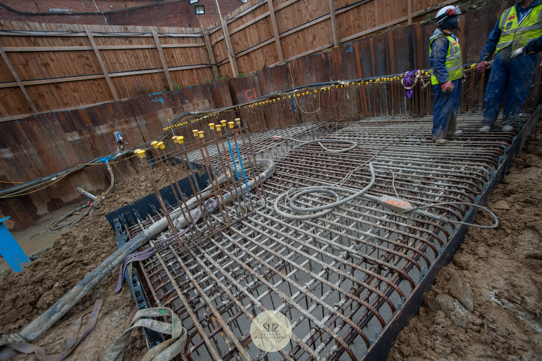  The concrete is poured into a cage to form a pile cap under Block C. 