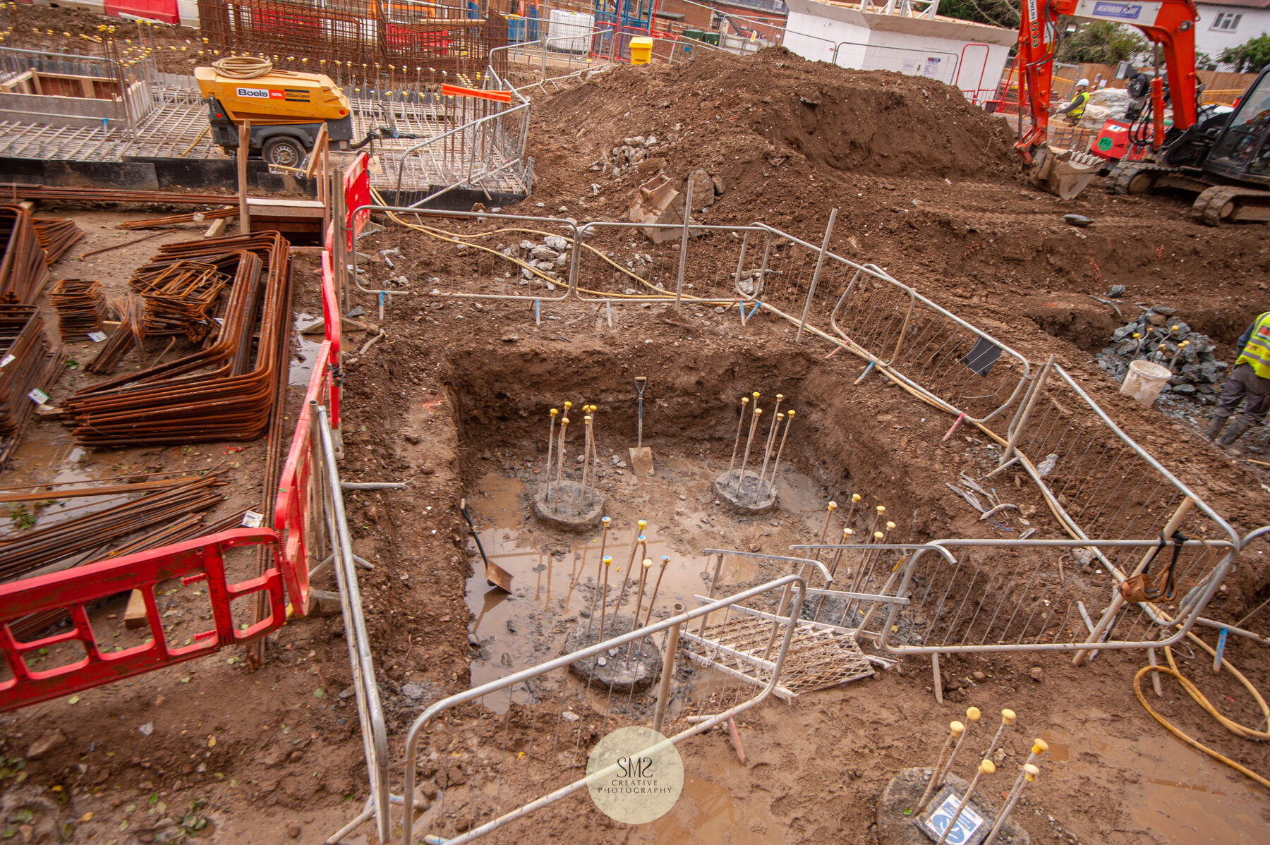  Four piles excavated in preparation for forming a pile cap. 