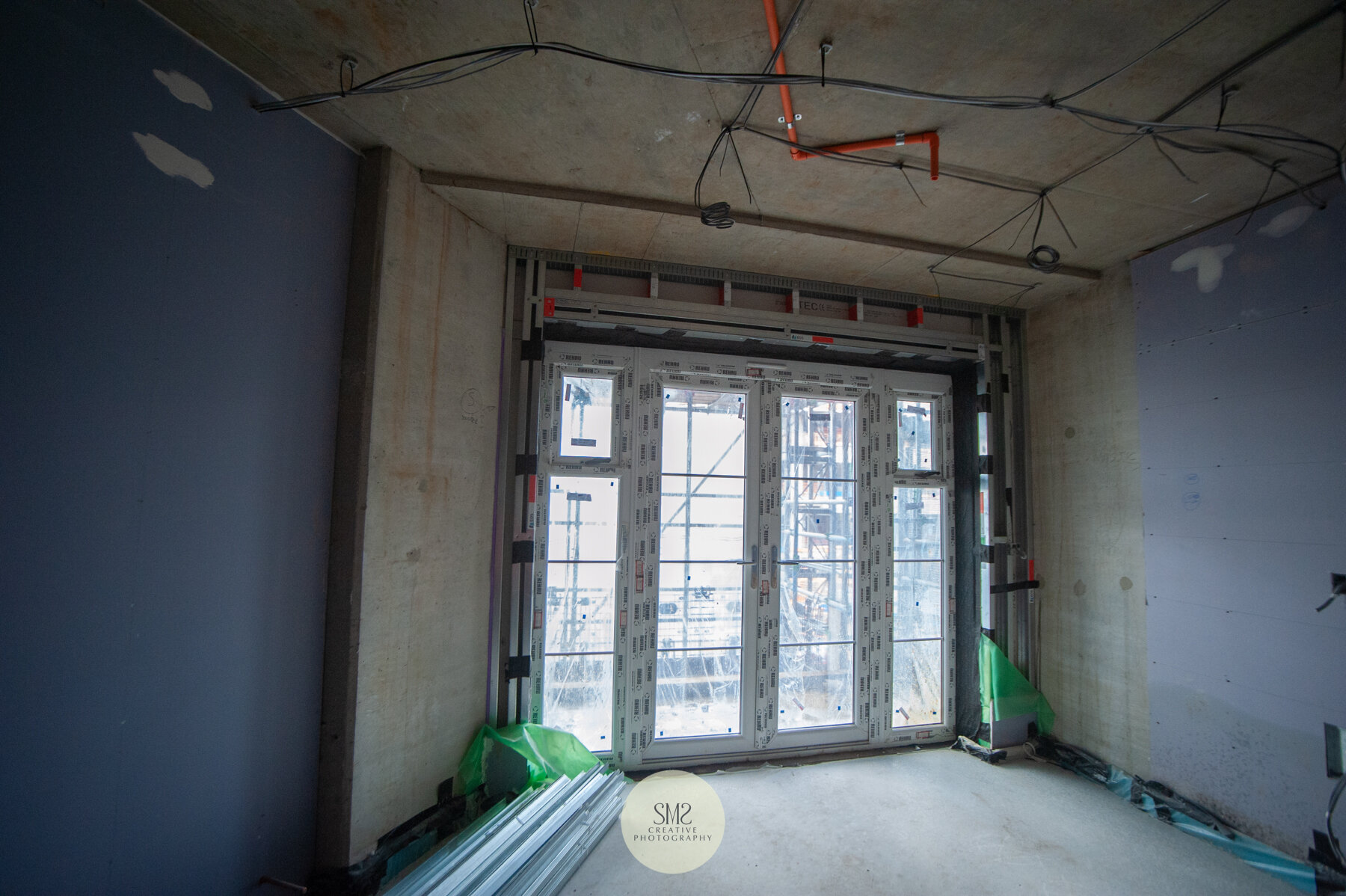  Inside one of the flats showing wiring and sprinkler pipes on the ceiling. 