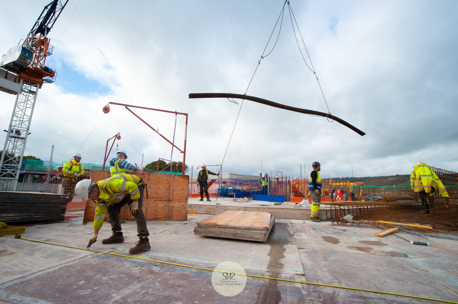  Block C level 5 – marking out the steel, preparing the slab for the next stage. The crane in the background bringing materials. 