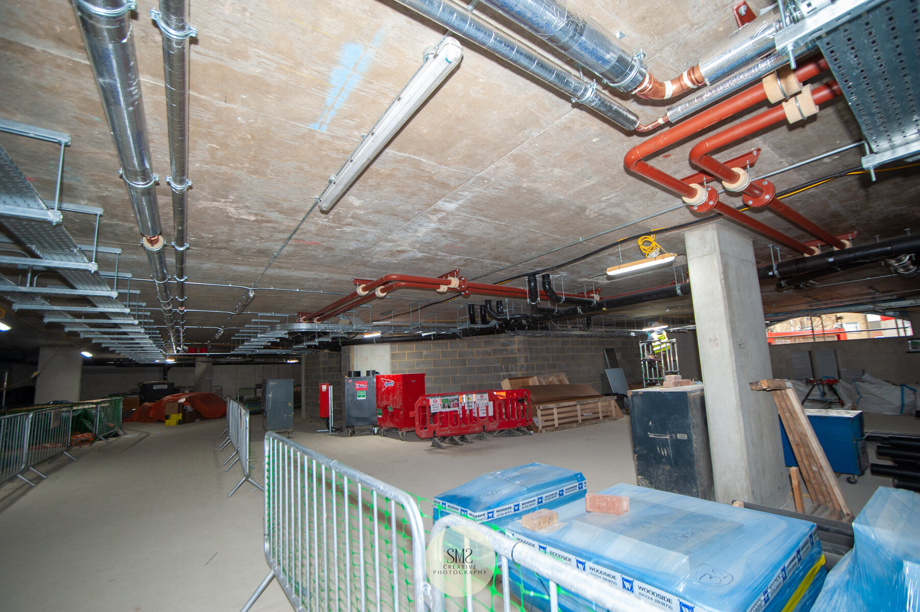  The car park beneath Block A – the pipe and cables are complete in the ceiling. 