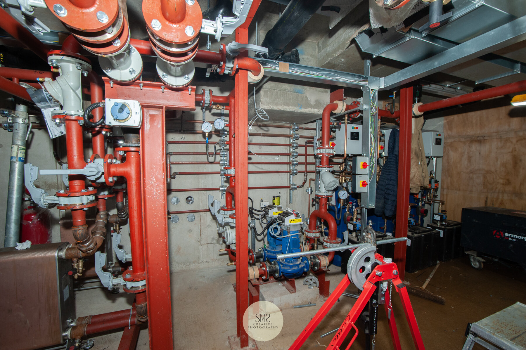  Inside the plant room that houses the boilers and water tank which serve all the apartments – Block C 