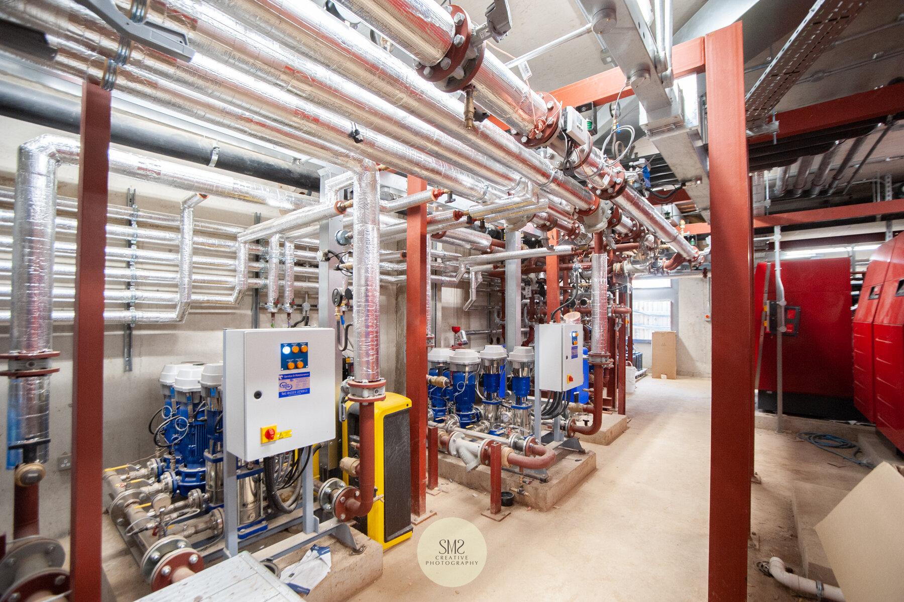  The same plant room showing the boilers and pumps for water and heating to service all the flats in all three blocks. 