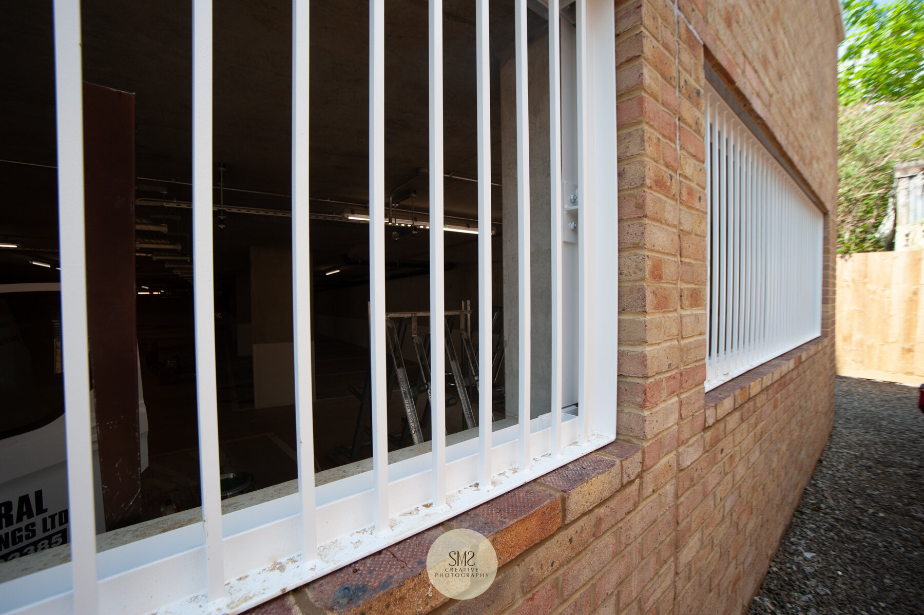  The maintenance walkway at the side of the car park showing the grills for ventilation. 