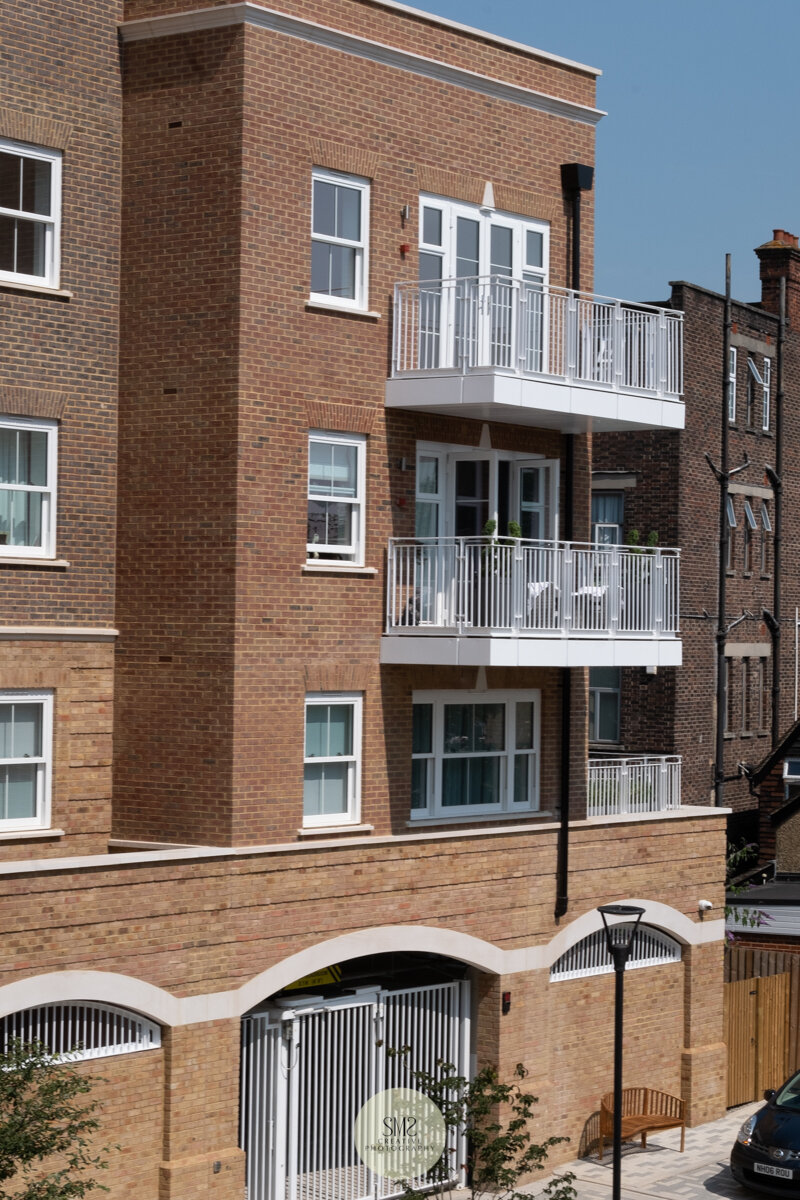  A close-up of the car park entrance to Block A with apartments above 