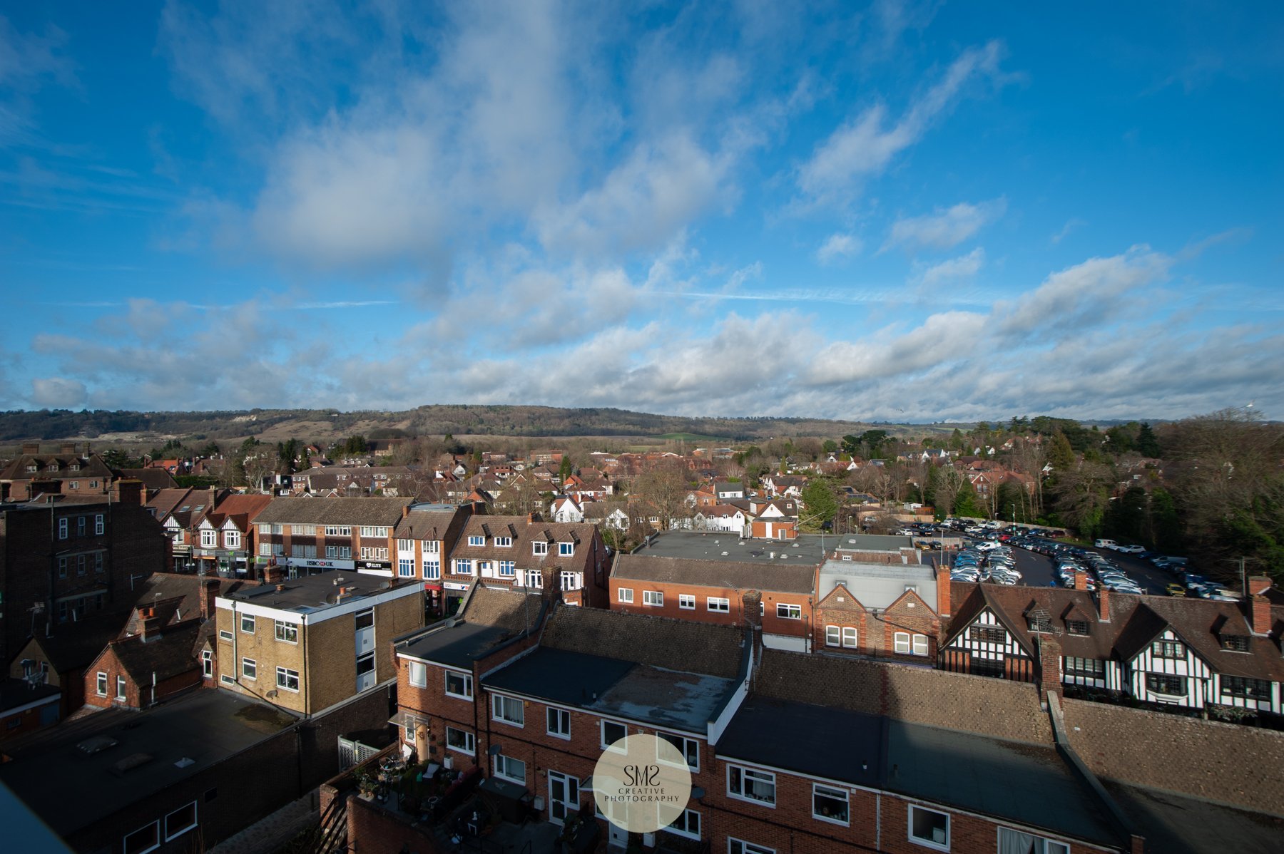  A view from one of the penthouse apartments towards the North Downs and Station Road East behind the shops. 