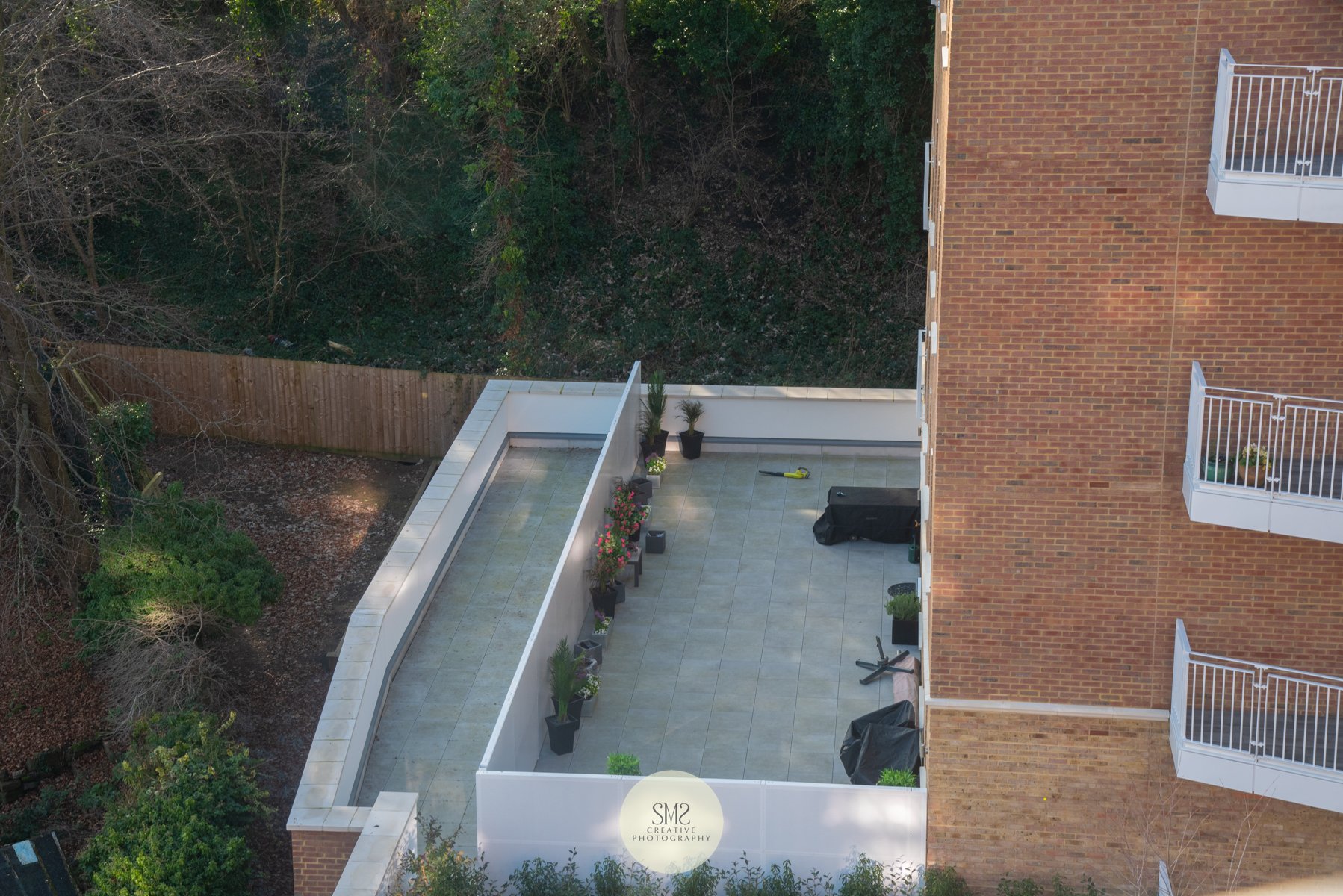  Looking down onto a terrace in Block B from a penthouse in Block C. 