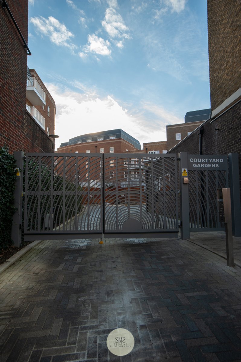  The entrance to Courtyard Gardens from Station Road East inbetween Starbucks and Gloss Hair Spa. 