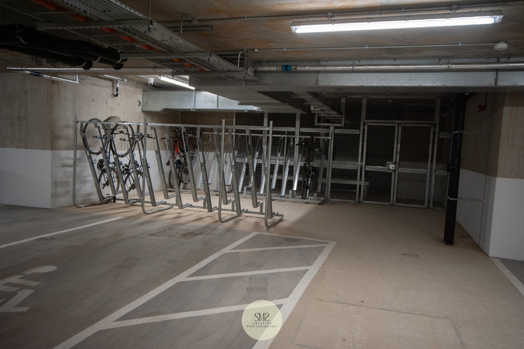  The car park beneath Block C Harwick House with bicycle stand. 