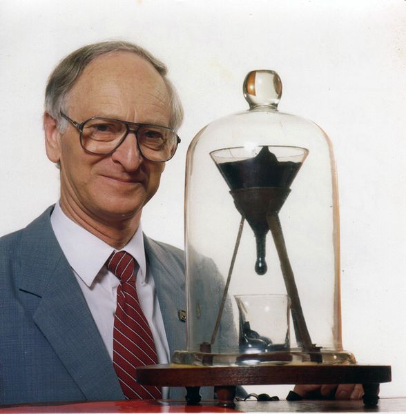 Professor Andrew White with the Pitch Drop Experiment
