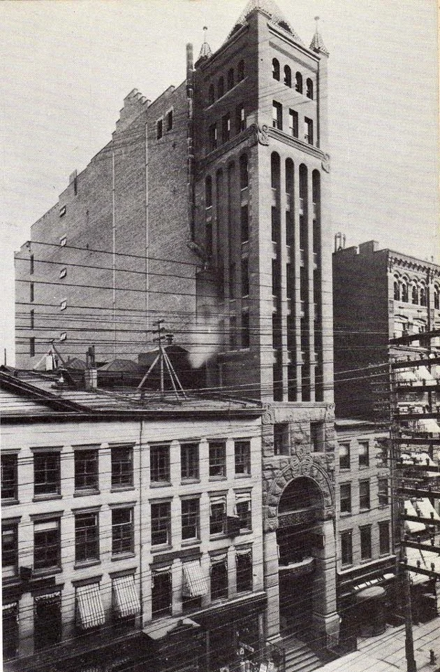 The Tower Building fitting snuggly between its neighbours