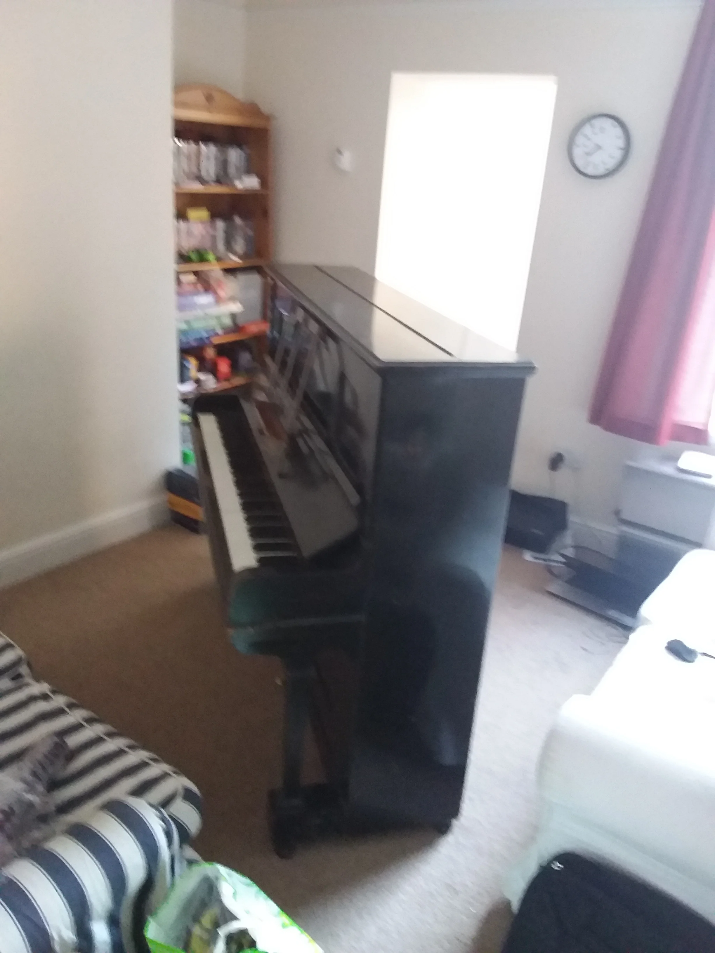 I spent about two days with the displaced piano rather dominating my sitting room.