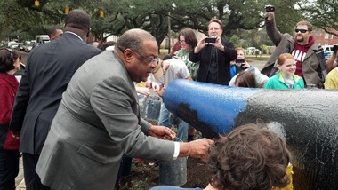 Mayor Sam Jones helping to paint the Cannon after the 2011 Tornado