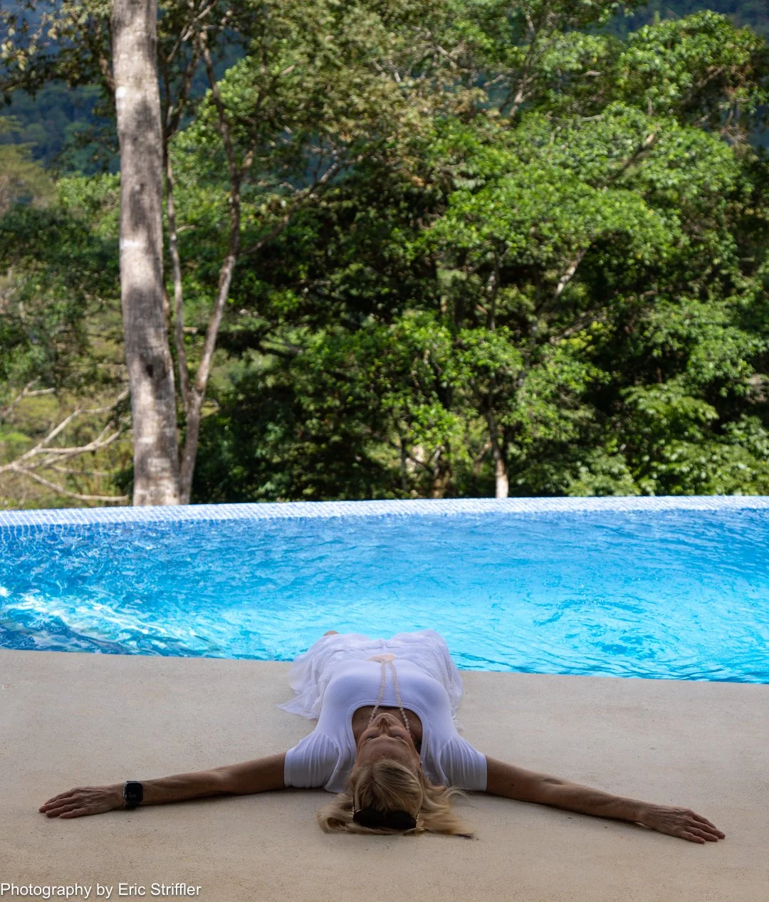 A Peaceful moment at the pool with the lush rainforest in the background