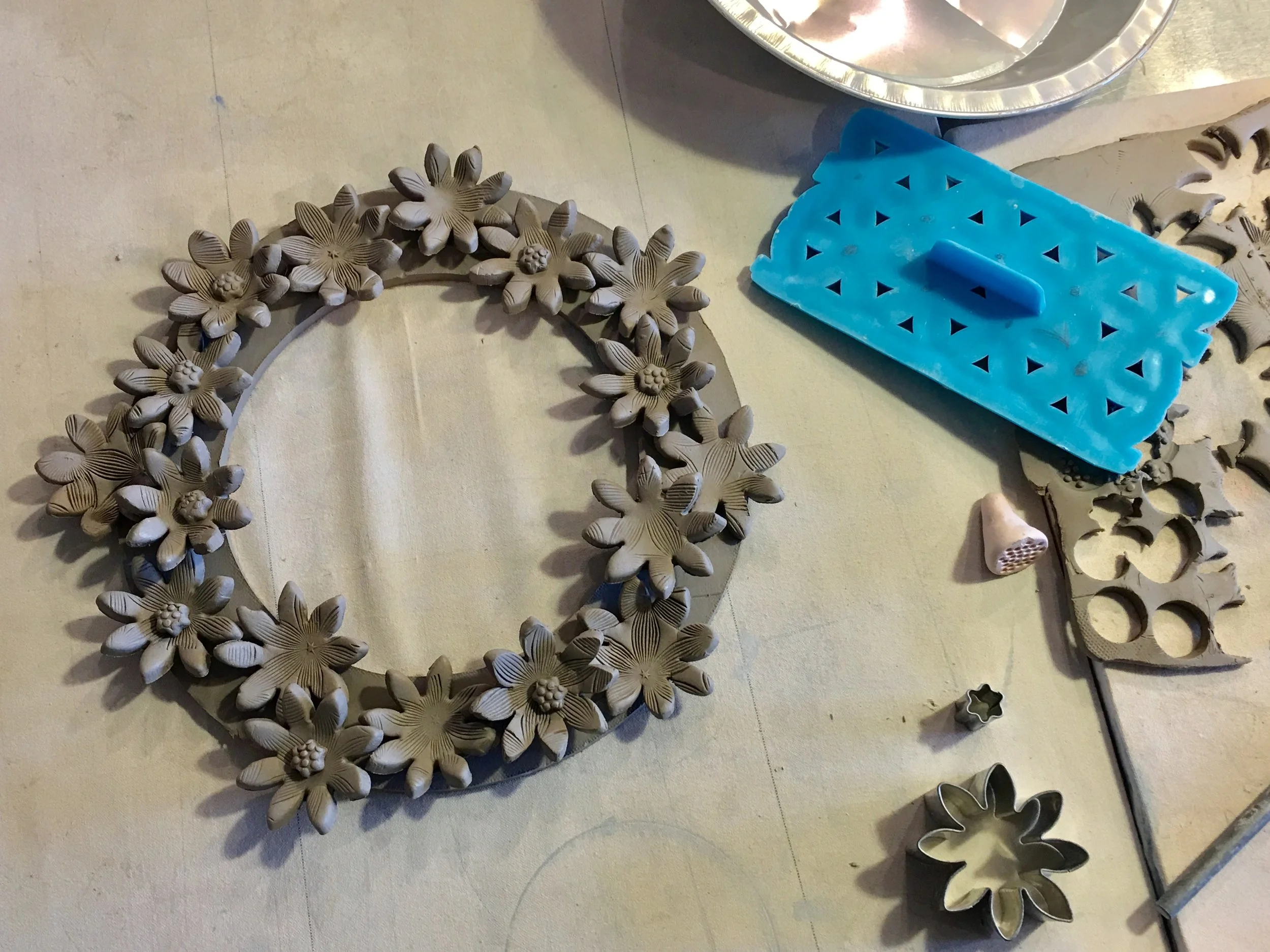 Unfired and unglazed project sample (we will insert the mirror after it is glazed!).