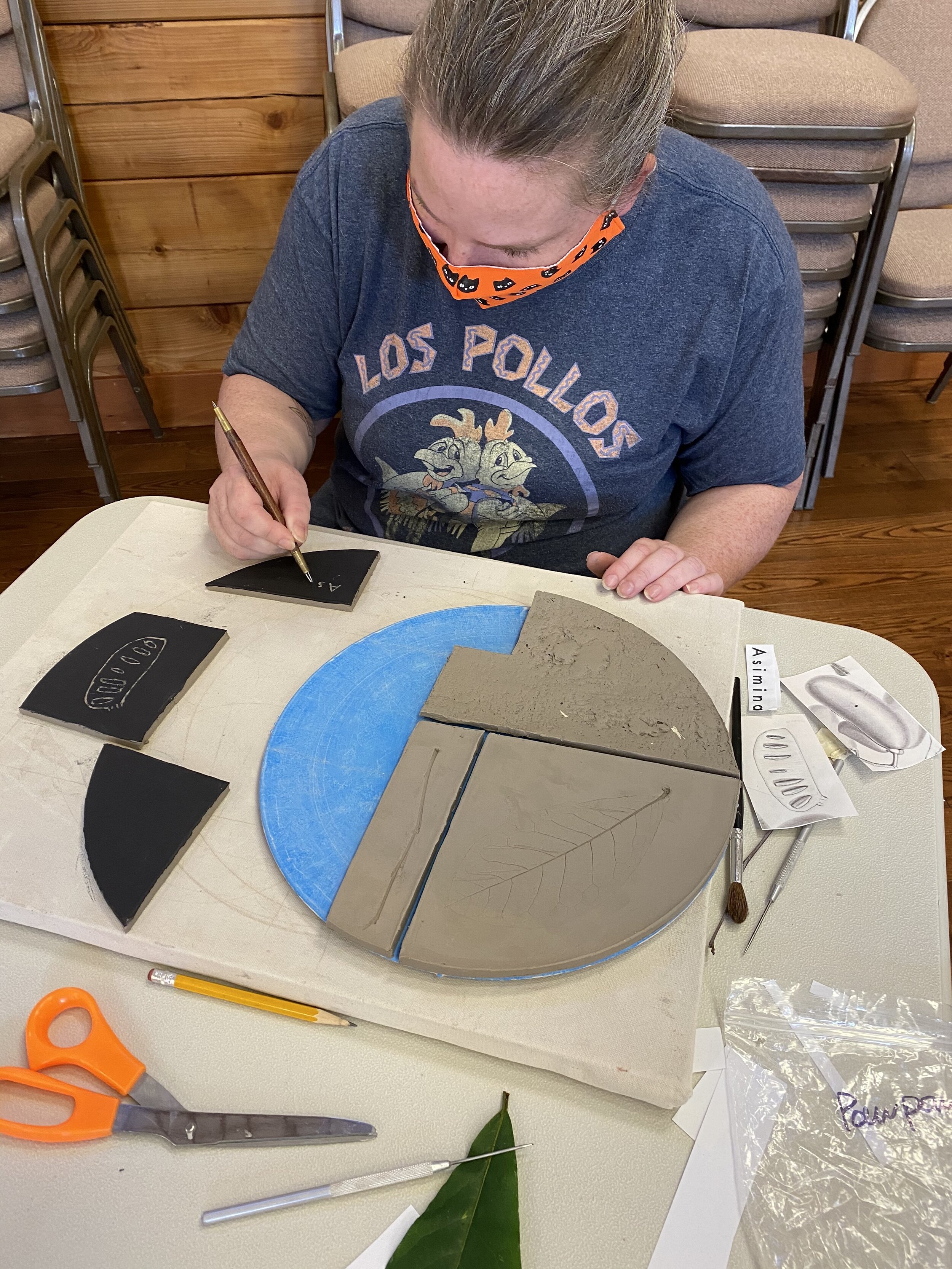  Jen working on sgraffito drawing for the Pawpaw tree. 