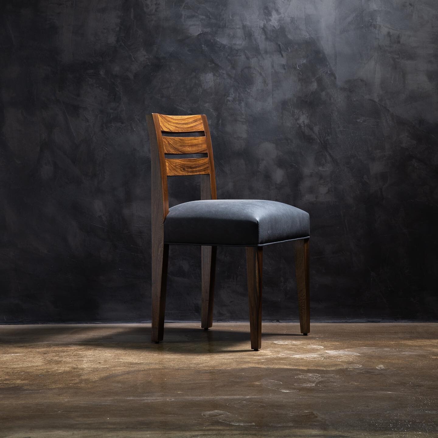 RENZO.  Shown here in Argentine Rosewood and COM (clients fabric), we have chair frames in stock and ready for upholstery in the material of your choice or Costantini leather.  Visit the newly launched materials section on our website for more info, 