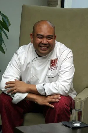Rogelio Aglibot of Yi Cuisine in Costantini Yi Highback Lounge Chair 