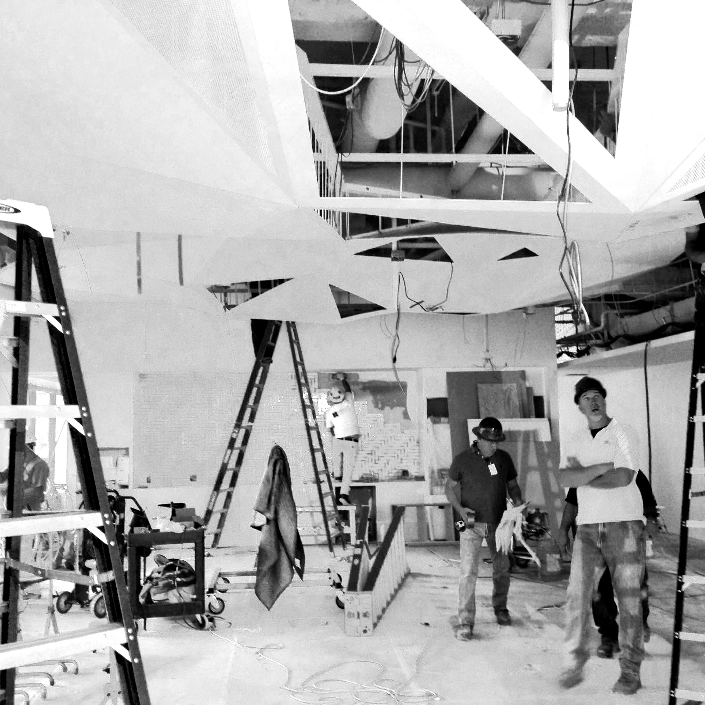 Hanging the fixture in the space.