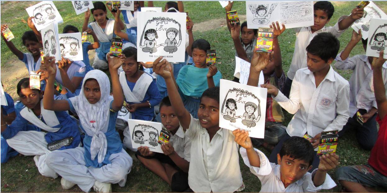 Kids in Dhaka, Bangladesh with their You=Love coloring books.
