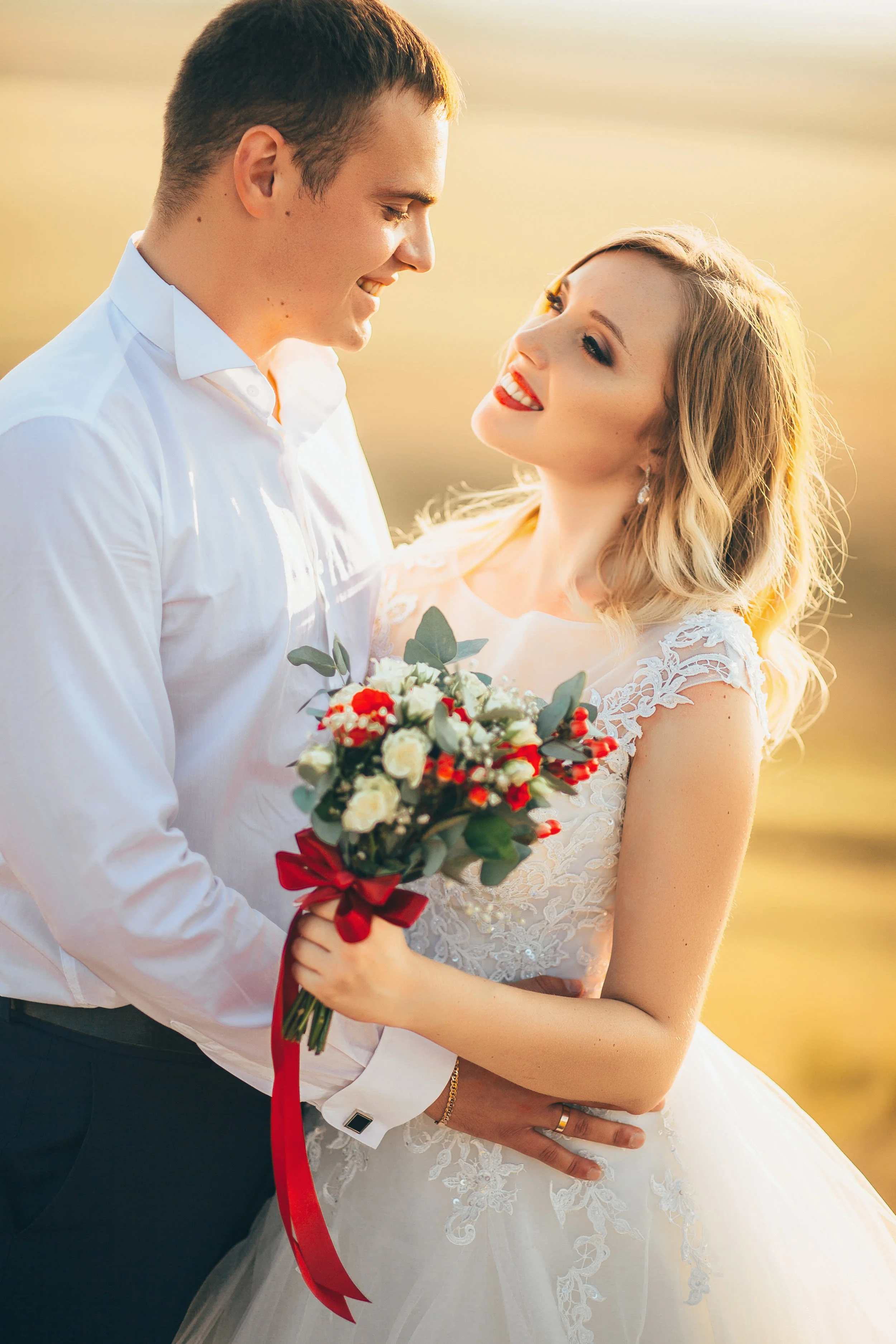 stylish gorgeous couple newlyweds standing on the rocks in the mountains