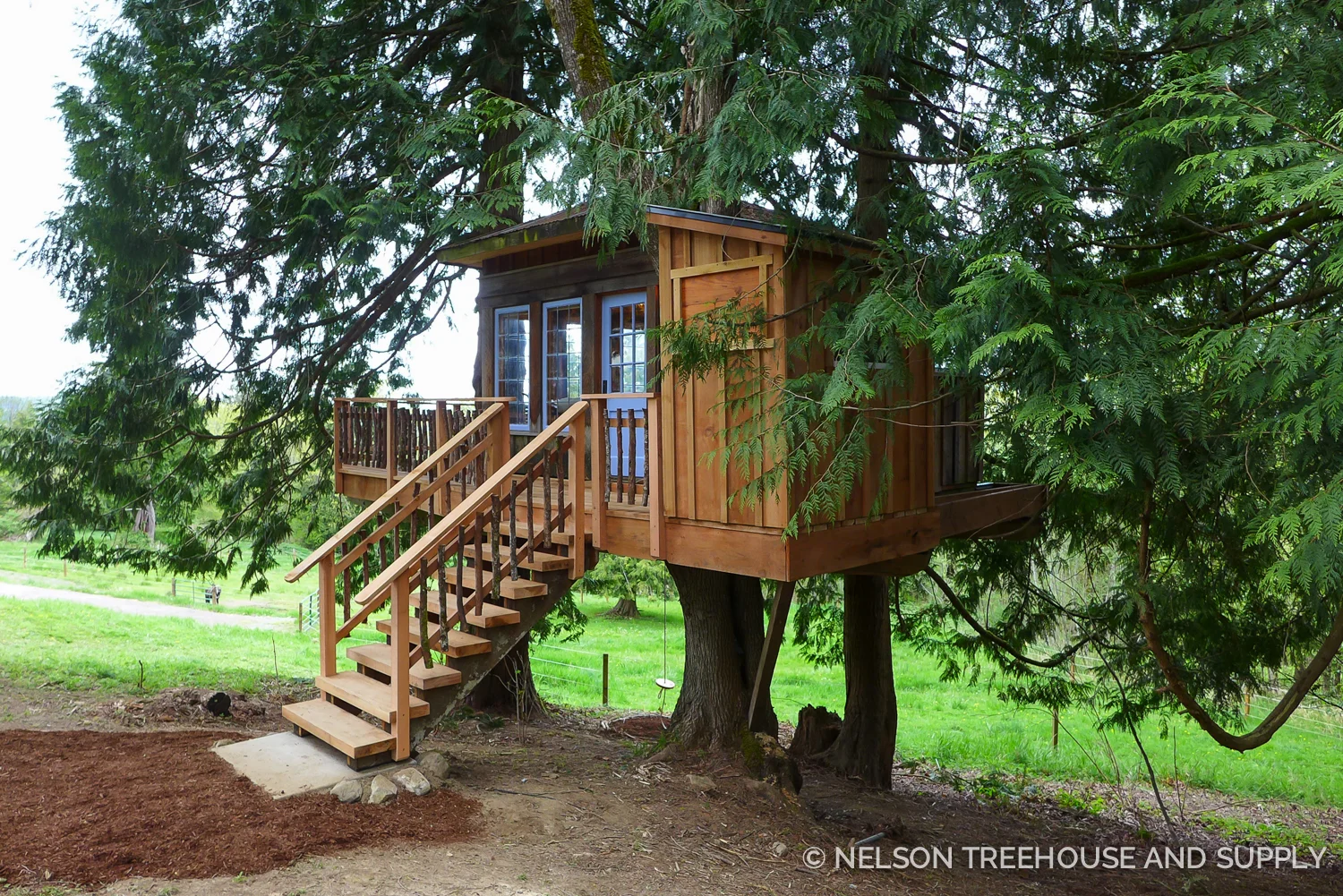 Updating the treehouse with pressure-treated wood, metal flashing, and sturdy railings will keep this treehouse safe and strong for years to come.