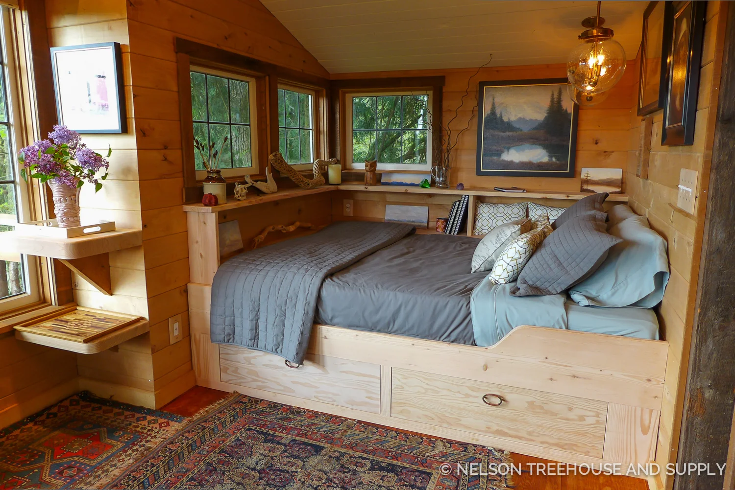 A queen-sized bed fits snuggly in this nook.