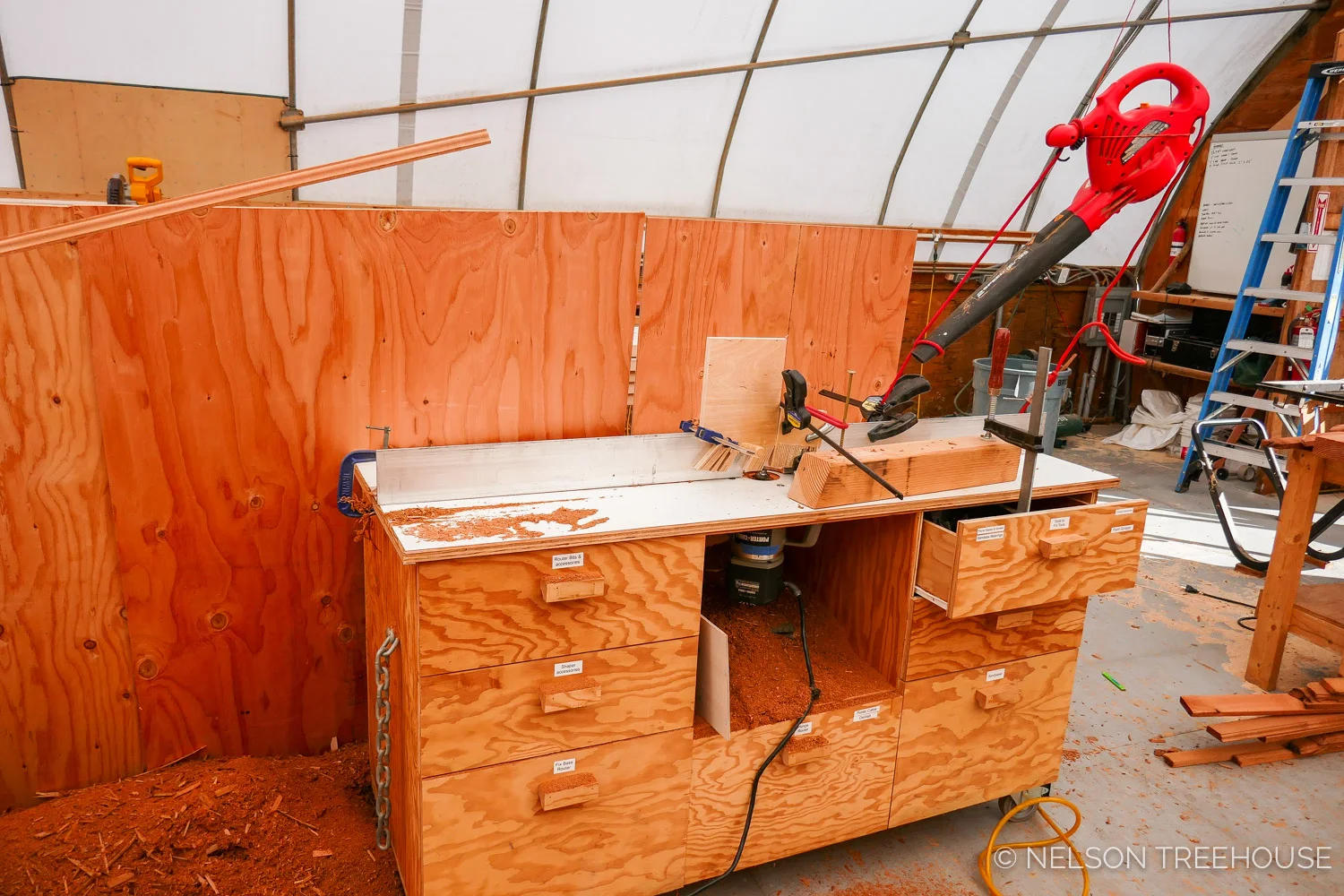 Nelson Treehouse Prefab for Treehouse Utopia - creative method for removing sawdust