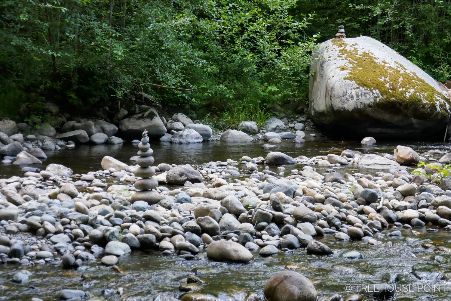 Guests Enjoy crafting cairns at the Raging River.