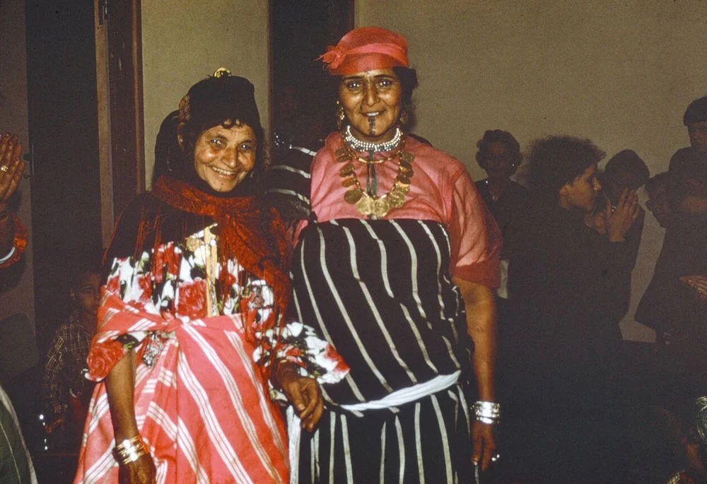 Abdul Gader's mother at left, with a professional dancer, at a bride's party.