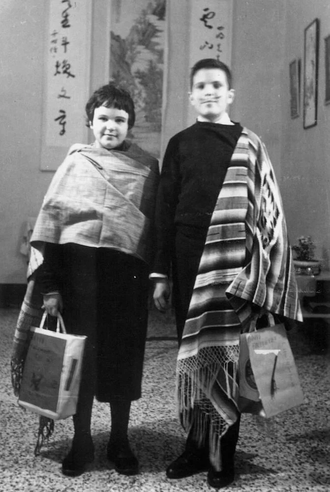 Carolyn and Steve trick-or-treating at the home of the Chinese Ambassador.