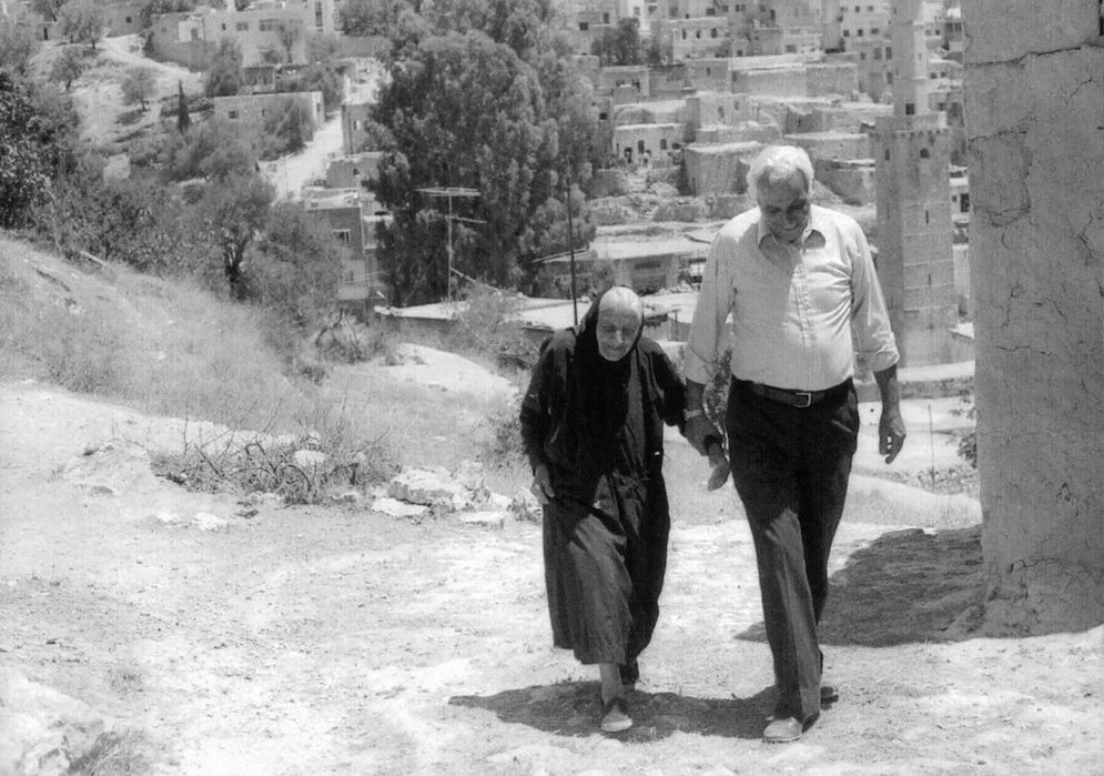 George walking with his aunt Wadia in Ajlun, the town where his father was born.