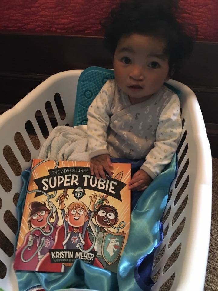 A fellow Super Tubie moments after he received his new book and Super Tubie cape! Go Tubie Power!