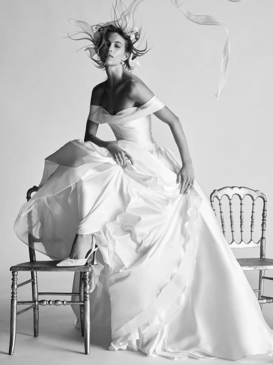 Meet Desmina by @watters 🩷 An iconic off-the-shoulder ball gown in sculptural polished satin, with asymmetrical draping and a fully structured corset beneath. Finished with a full skirt for quiet drama!

&bull;
&bull;
&bull;
&bull;

#weddingtrends #