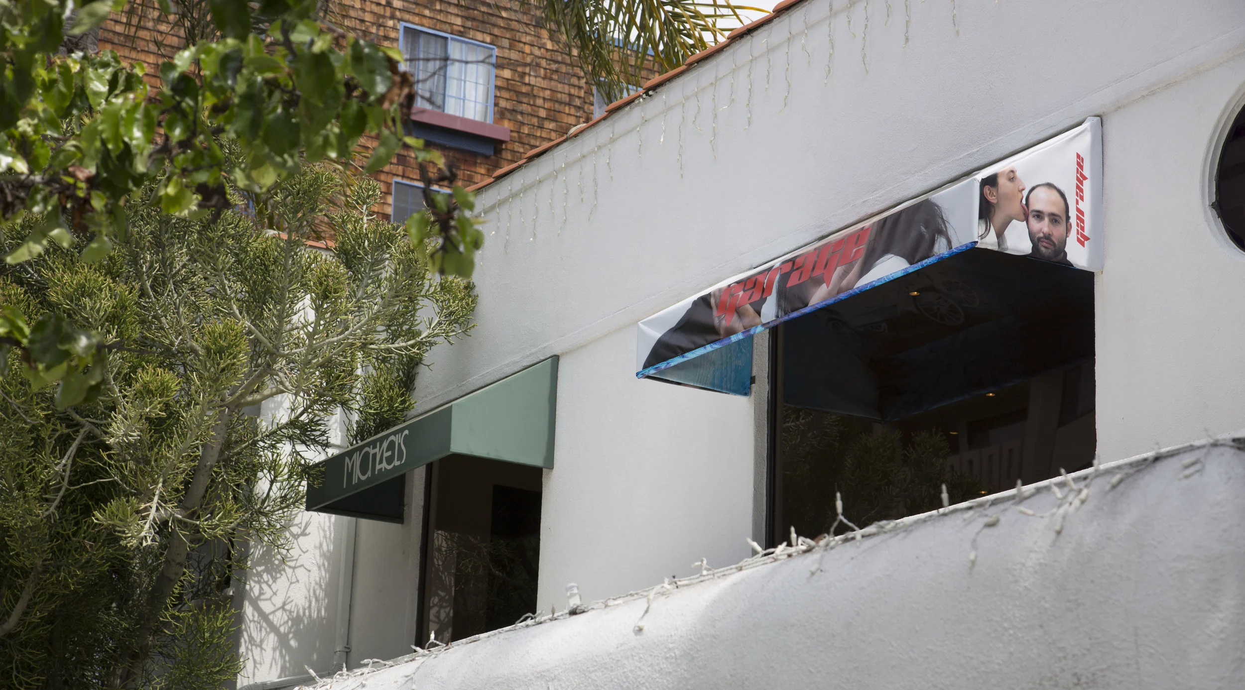Olivia Erlanger/Luis Ortega Govela Authorship Shade , 2018, Hacked Awning Steel Frame with Digital print on vinyl, author portrait by Paul Mpagi Sepuya, 8.3 x 6.1 x 2 feet, wall piece when show ends