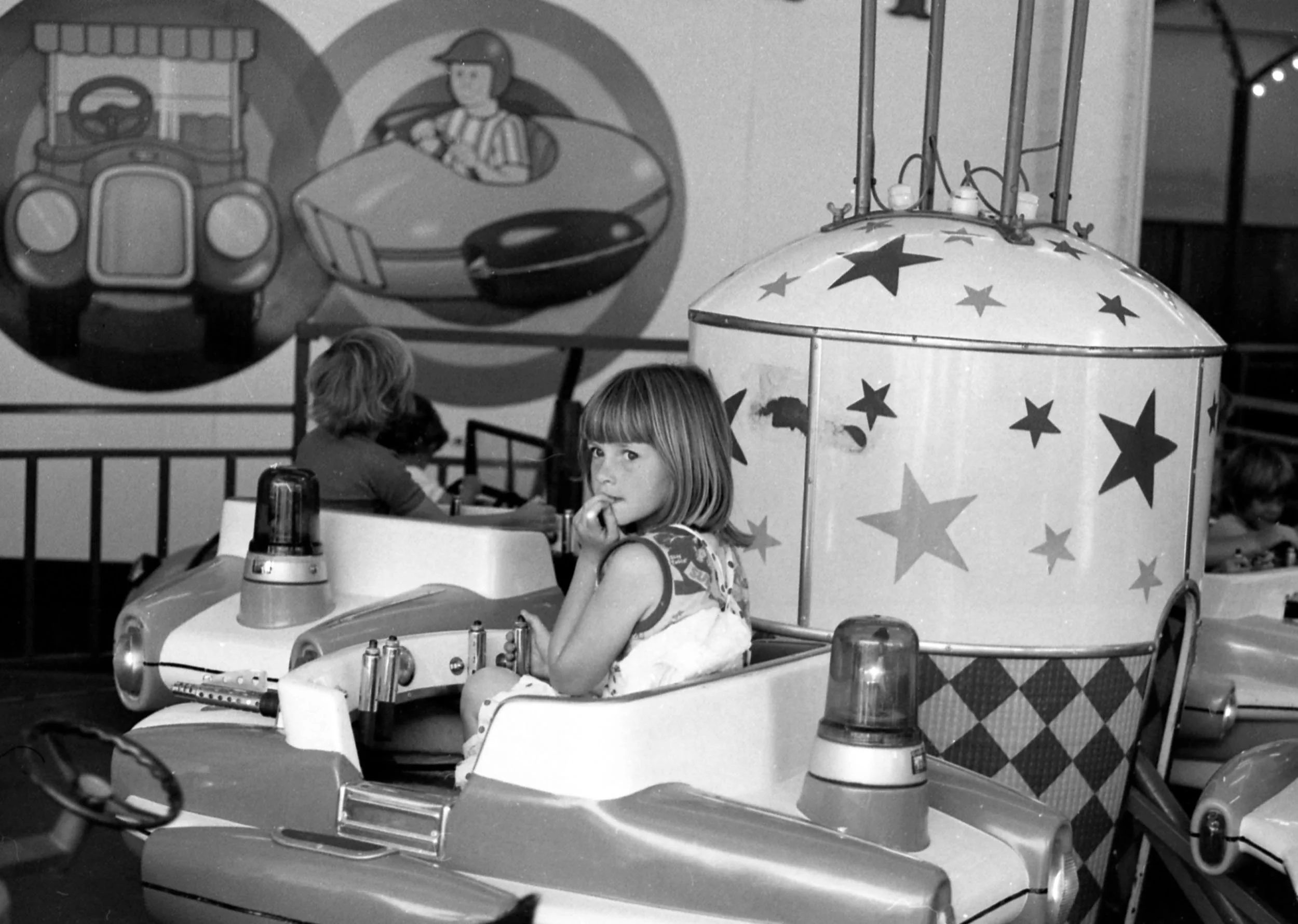   Uneasy young rider at Luna Park:  St Kilda, Jan 1977.  
