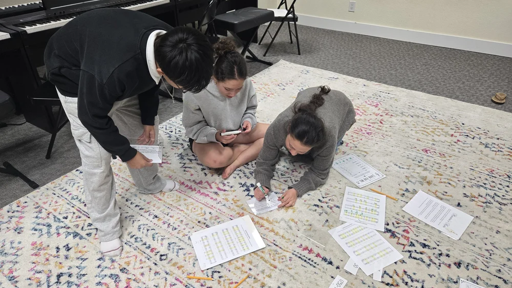 Heart Beats students solving musical escape-room puzzles together