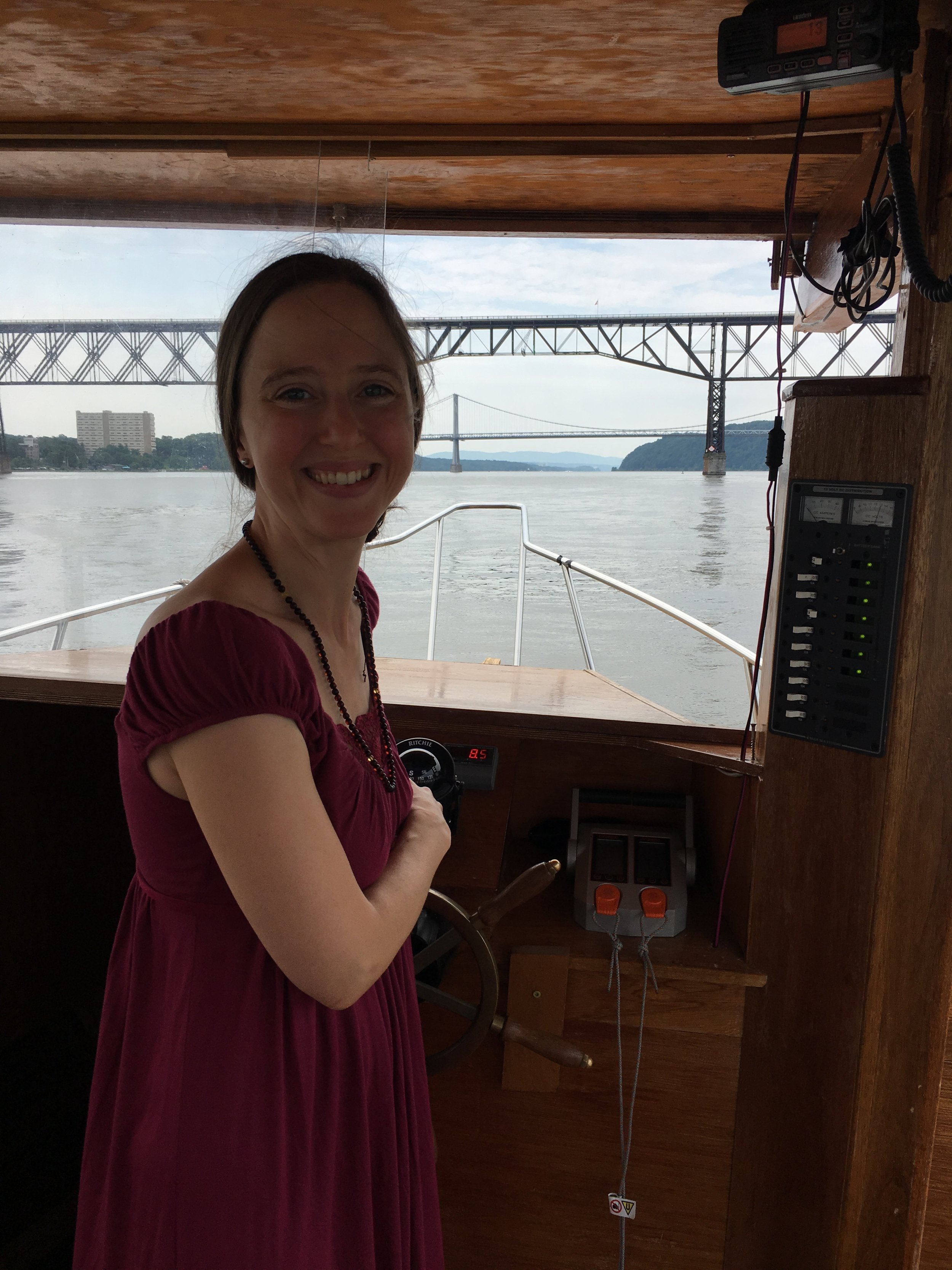 At the helm of Solar Sal, approaching Walkway Over the Hudson and the Mid-Hudson/FDR Bridge