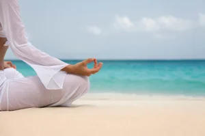 Person-seated-meditating-at-the-beach.jpg