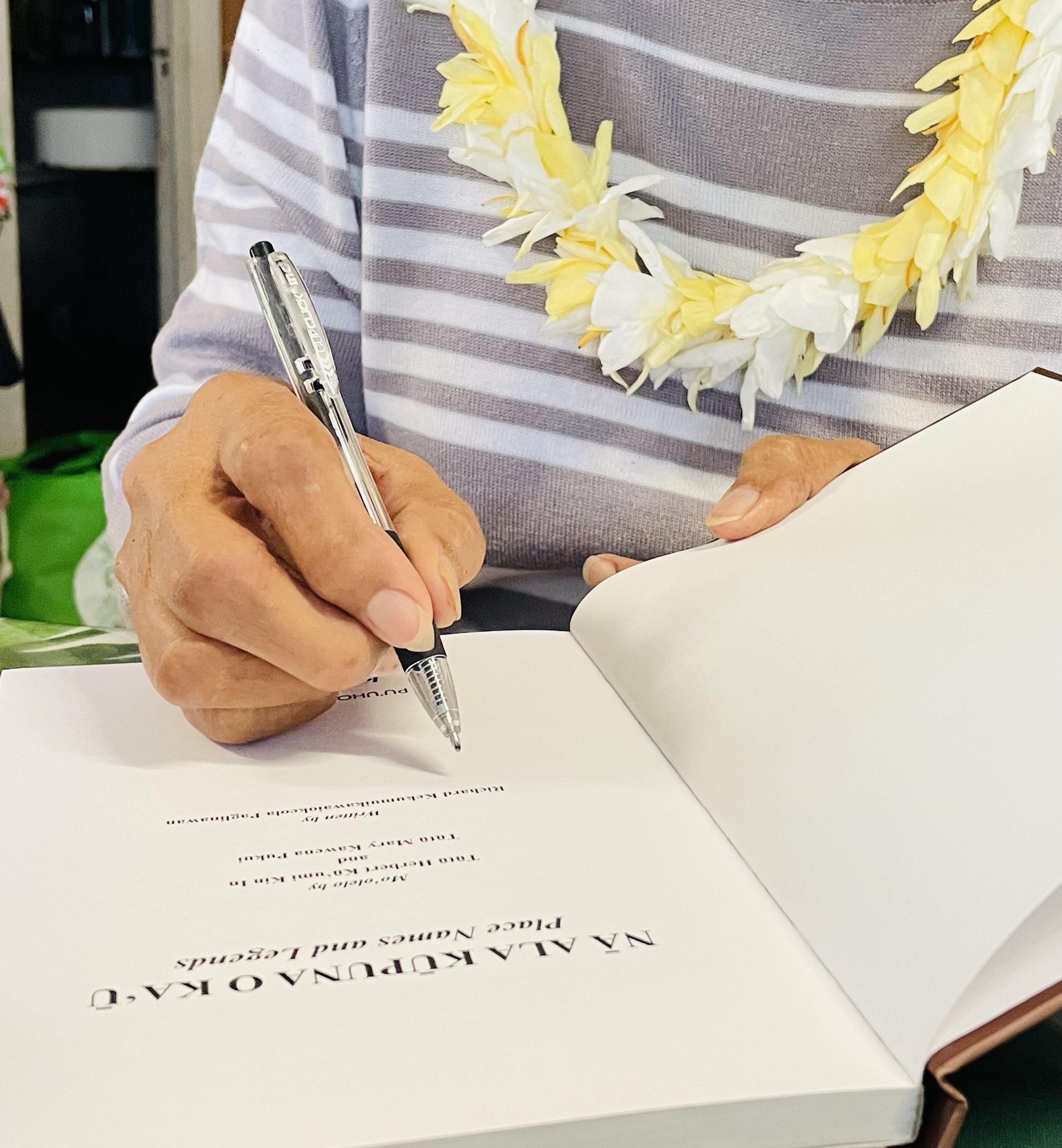 Aunty signing Kaʻu book.jpg