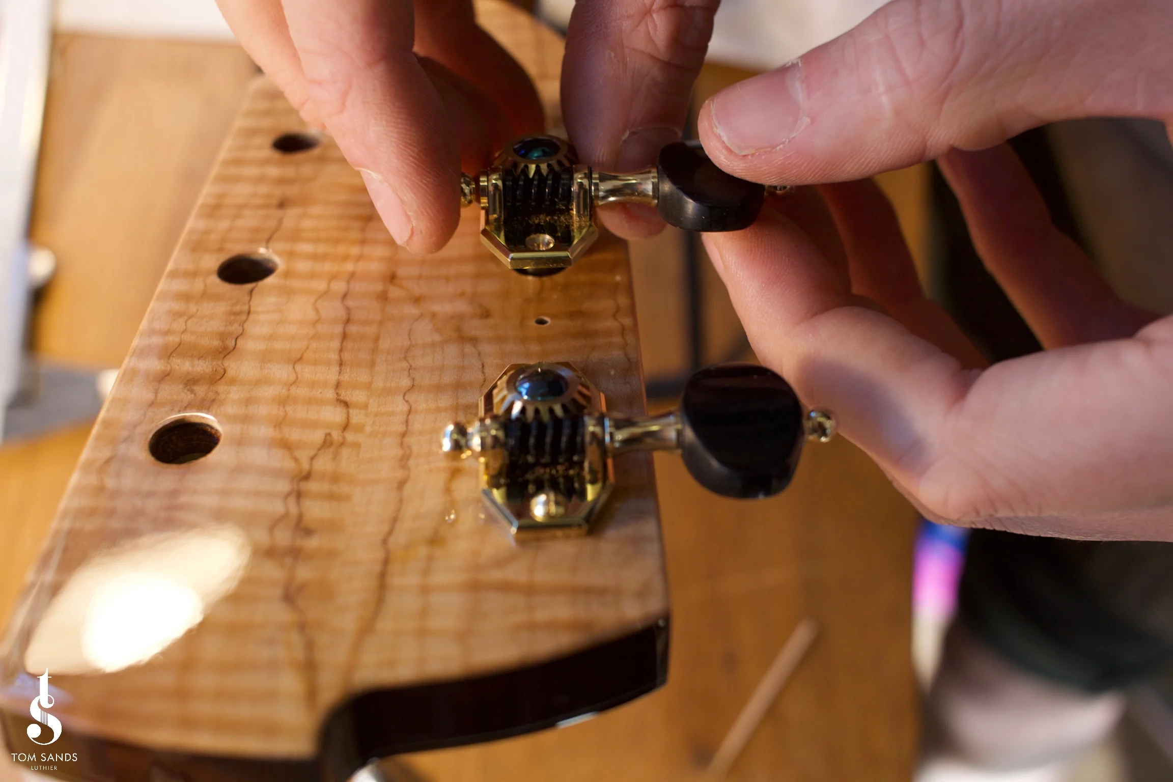 Installing the handmade Robson tuners.