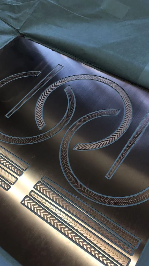 Our designs etched into copper.