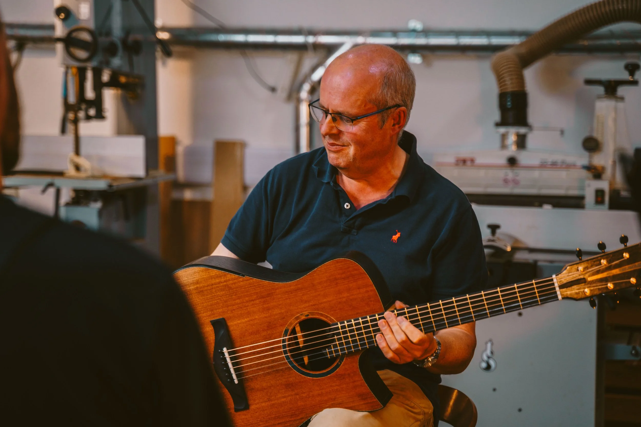 Customer with a Tom Sands handmade hand-built acoustic guitar