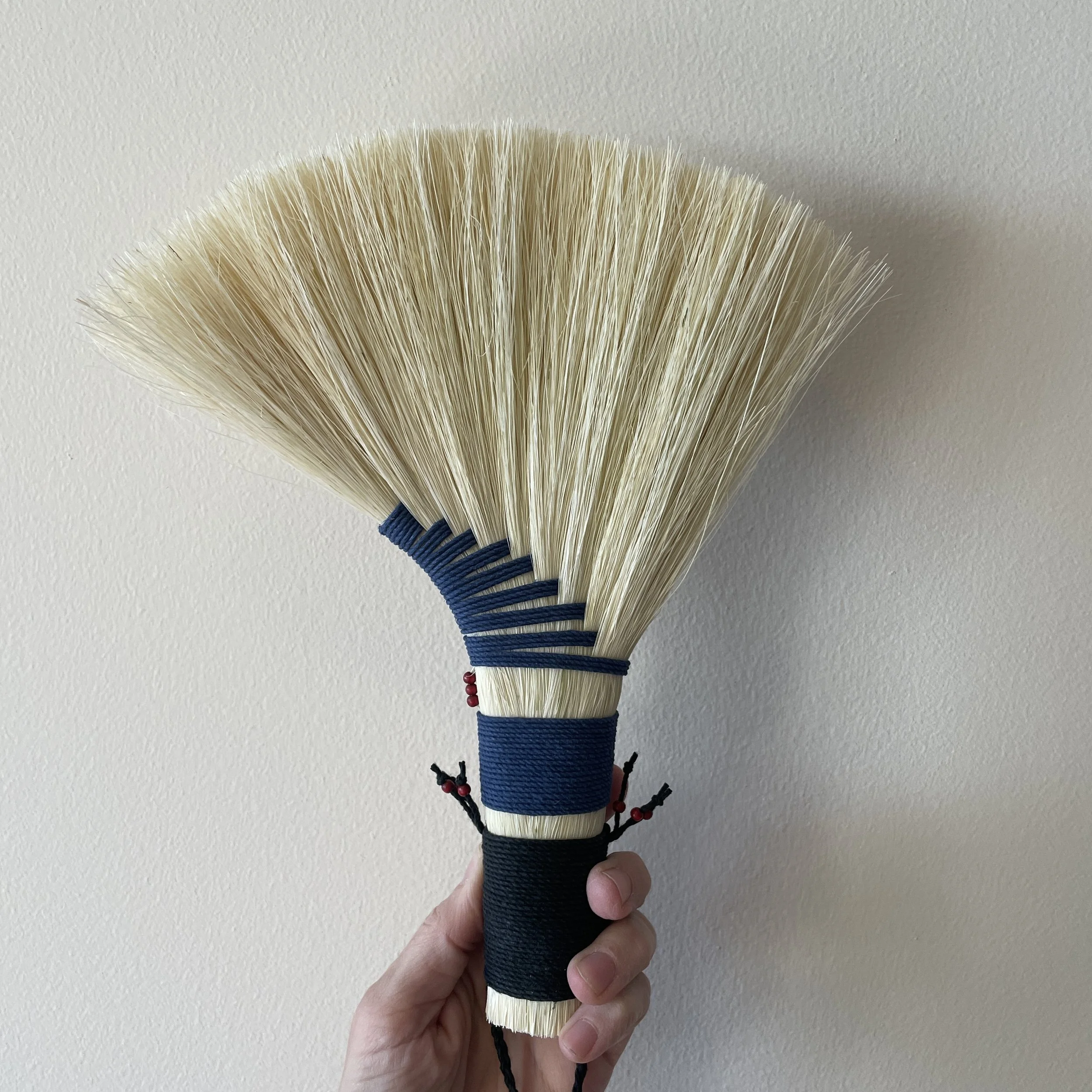 agave hand broom, black and blue